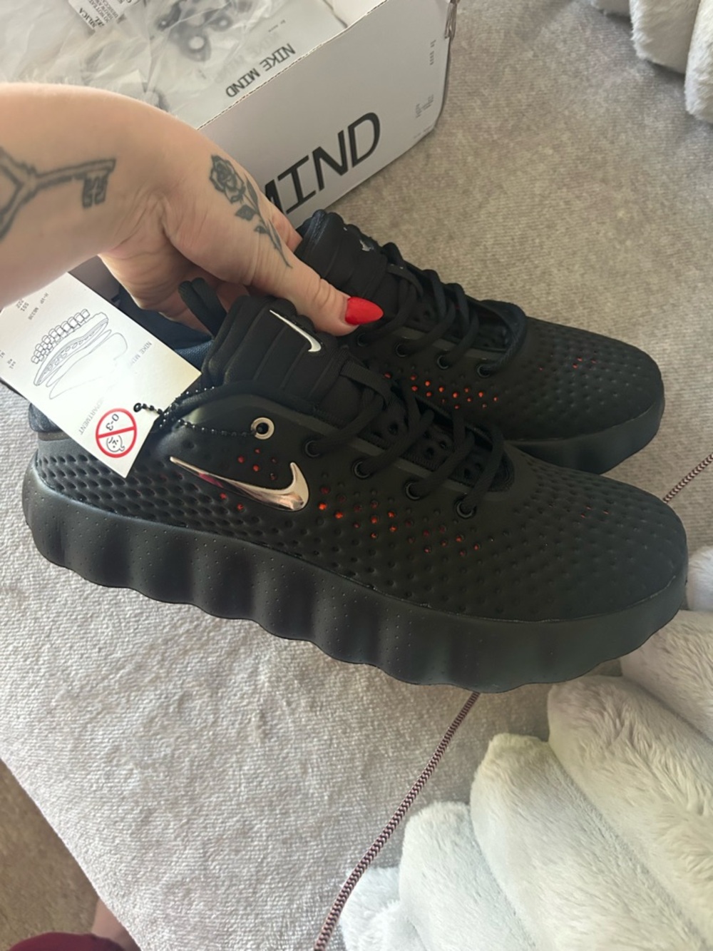 Nike Black Sneakers with Silver Swoosh and Orange Underlay